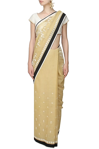 Gold and off white floral embroidered saree and quilted blouse set by SWGT By Shweta Gupta