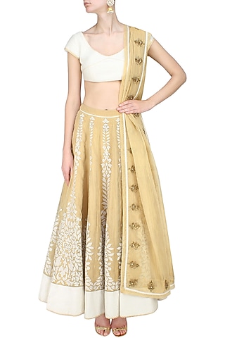 Gold floral chanderi applique work lehenga and corset blouse set by SWGT By Shweta Gupta
