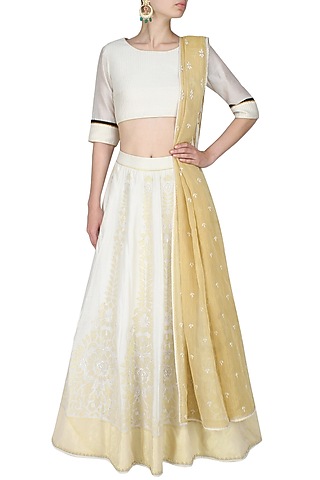 Ivory and gold aureate pale handcut motifs blouse and lehenga set by SWGT By Shweta Gupta