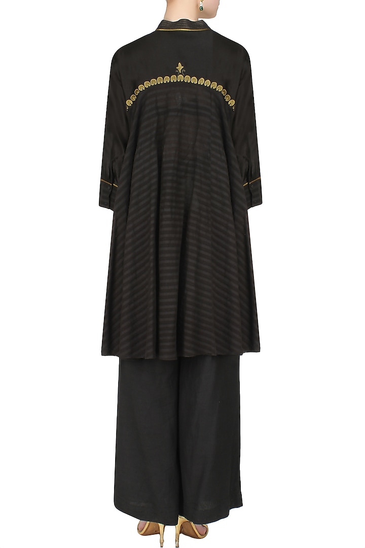 Black handcut motif back winged tall shirt available only at Pernia's Pop Up Shop.