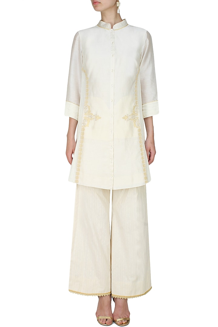 Ivory handcut motif back winged tall shirt available only at Pernia's Pop Up Shop.