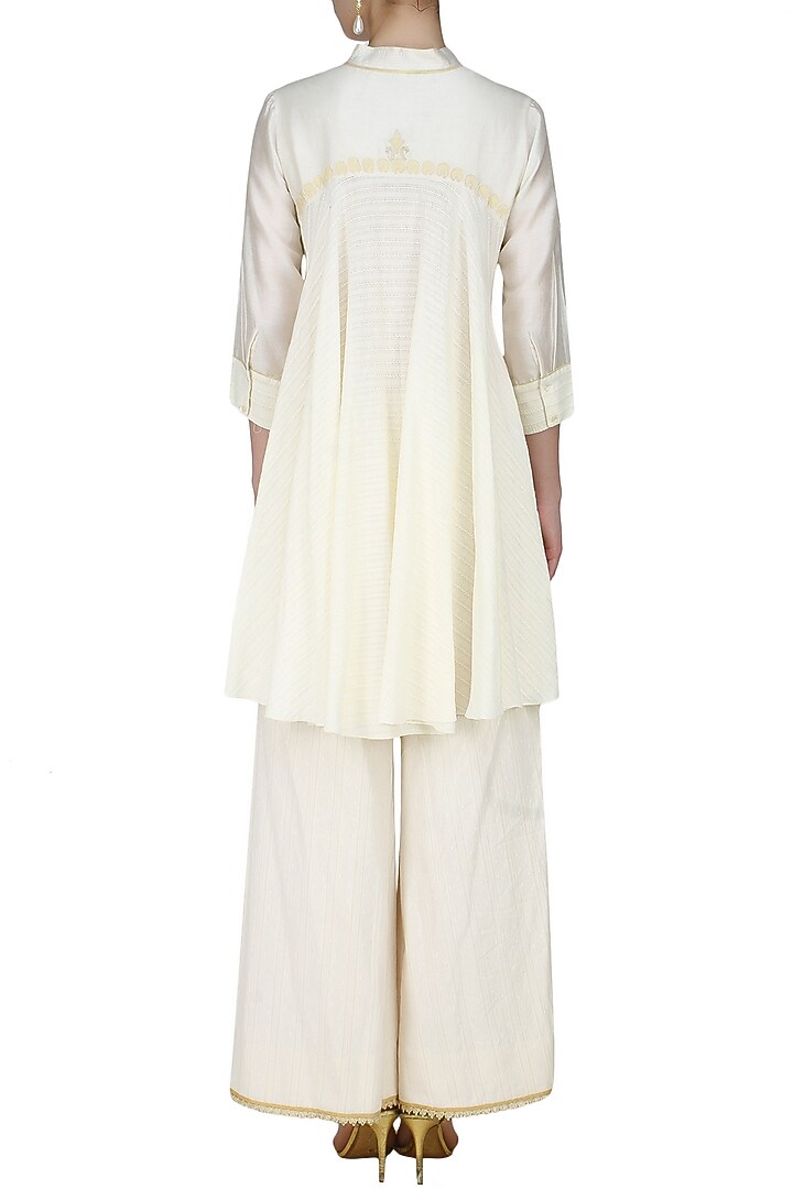 Ivory handcut motif back winged tall shirt available only at Pernia's Pop Up Shop.