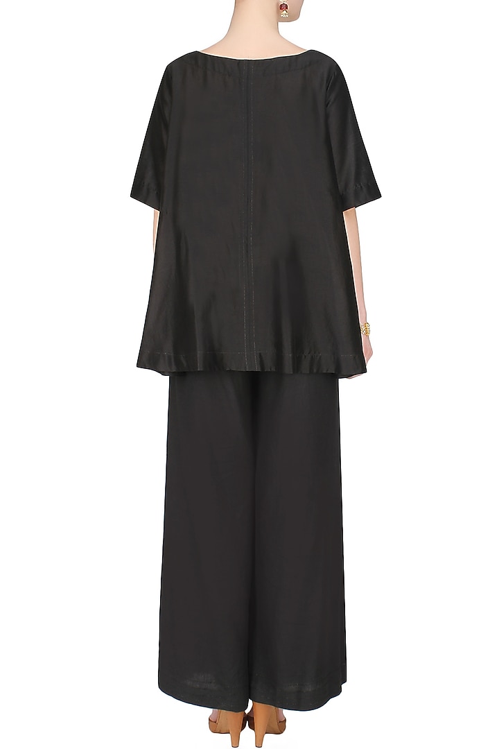 Black handcut motif asymmetric flared top available only at Pernia's Pop Up Shop.