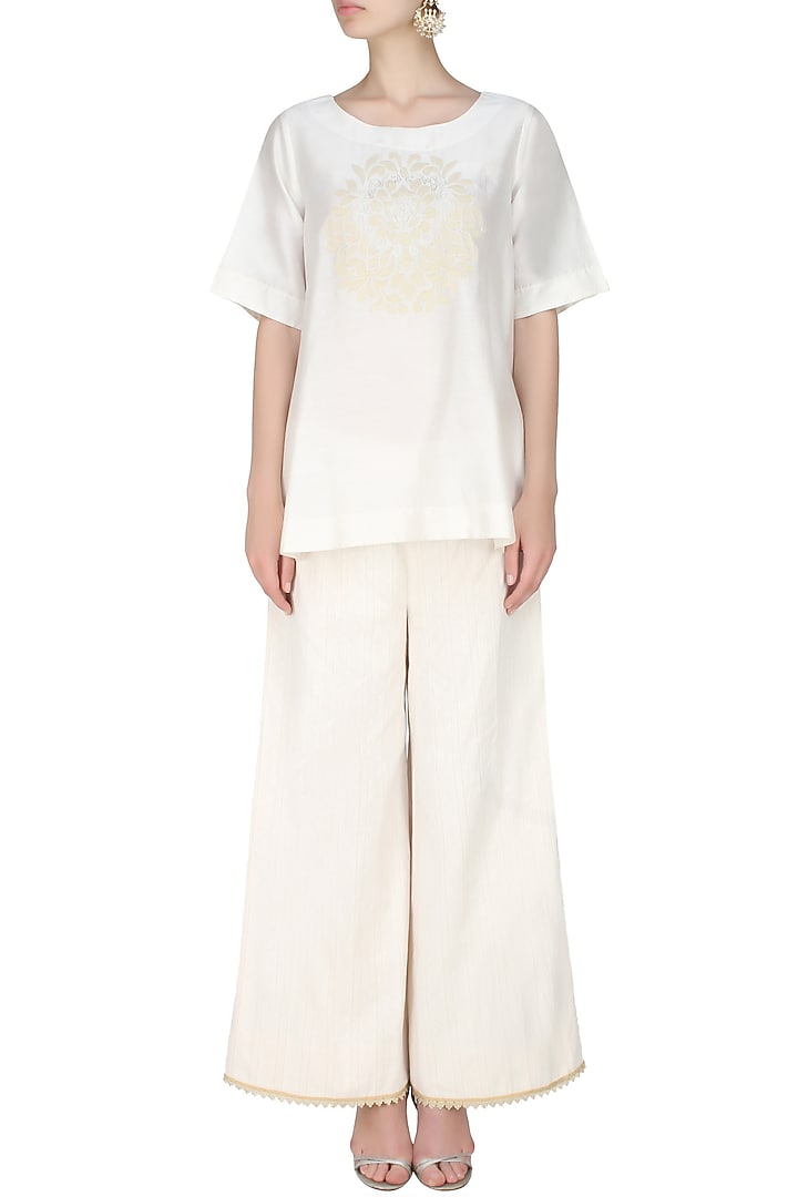 Ivory handcut motif asymmetric flared top available only at Pernia's Pop Up Shop.