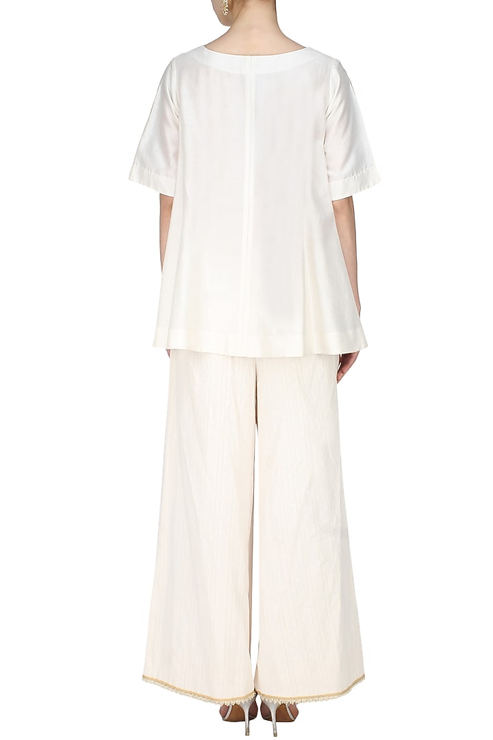Ivory handcut motif asymmetric flared top available only at Pernia's Pop Up Shop.
