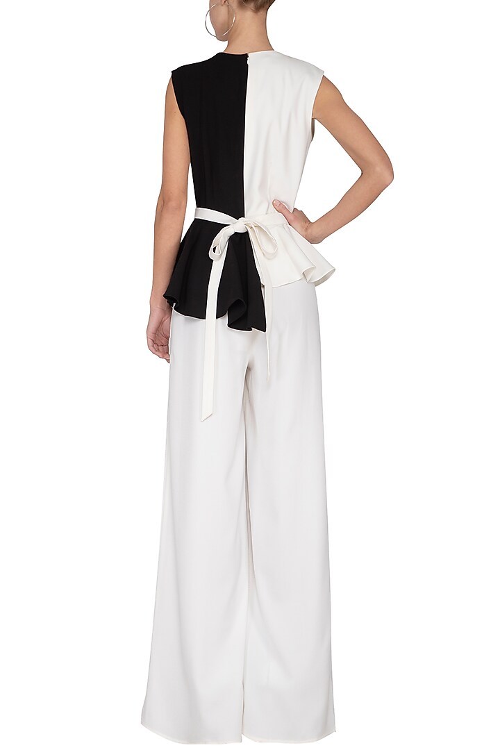 Black and ivory pleated peplum jumpsuit by Swatee Singh at Pernia's Pop Up Shop