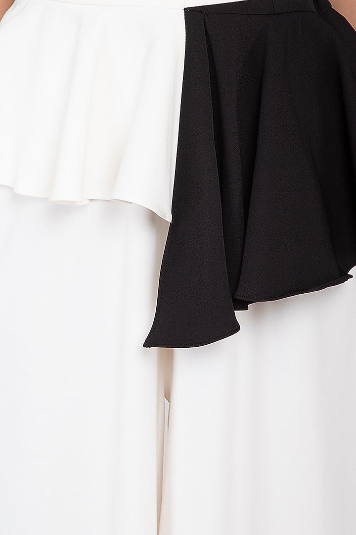 Black and ivory pleated peplum jumpsuit by Swatee Singh at Pernia's Pop Up Shop