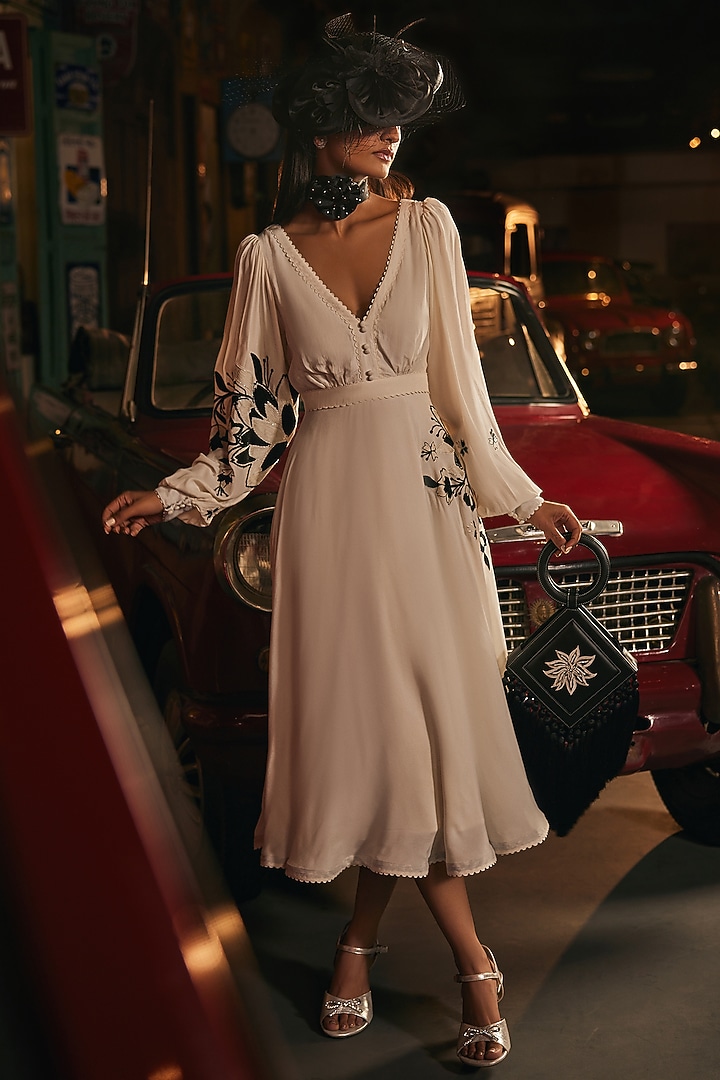 White Crepe Machine & Hand Embroidered Flared Vacation Dress by TABEER INDIA at Pernia's Pop Up Shop