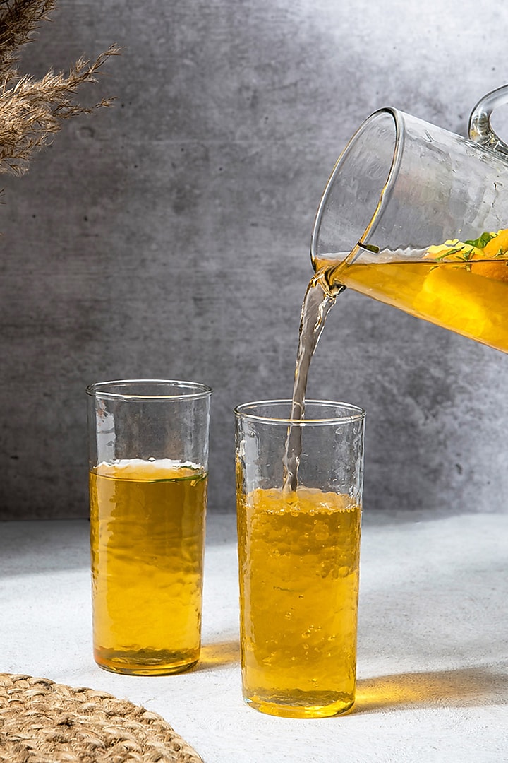 Transparent Glass Hammered Pitcher and Glasses Set by The Table Fable at Pernia's Pop Up Shop