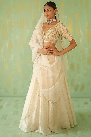 Cream Embroidered Lehenga Set by POULI
