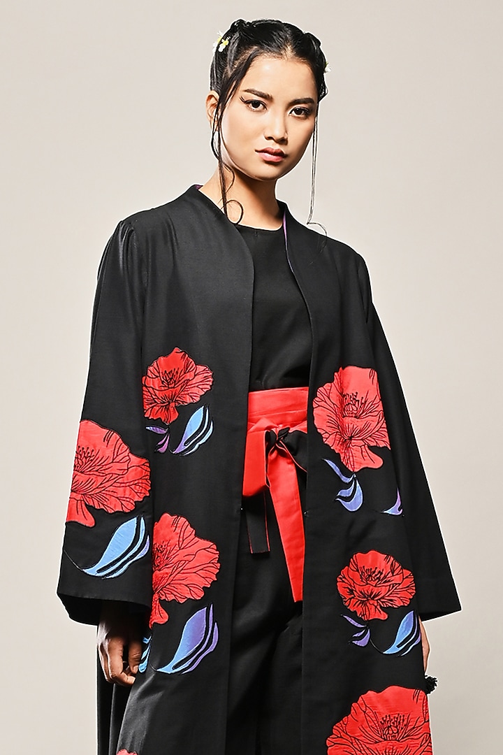 Black Cotton Silk Floral Applique Long Jacket by TAIKA by Poonam Bhagat at Pernia's Pop Up Shop