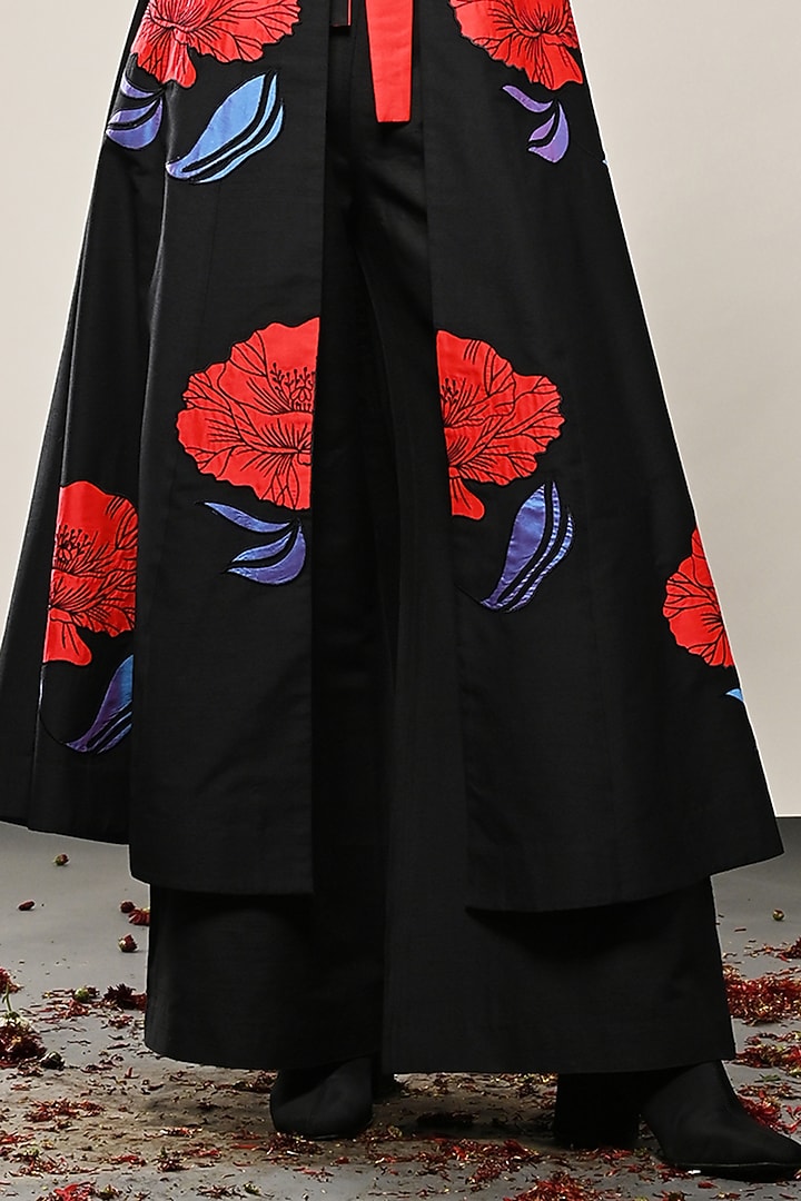 Black Cotton Silk Floral Applique Paneled Long Jacket by TAIKA by Poonam Bhagat at Pernia's Pop Up Shop