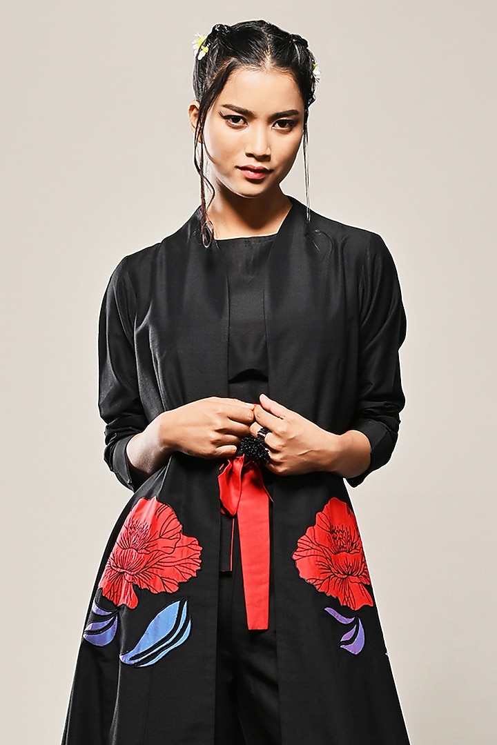 Black Cotton Silk Floral Applique Paneled Long Jacket by TAIKA by Poonam Bhagat at Pernia's Pop Up Shop
