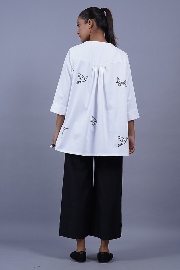White Cotton Machine Embroidered Top by Taika By Poonam Bhagat at Pernia's Pop Up Shop