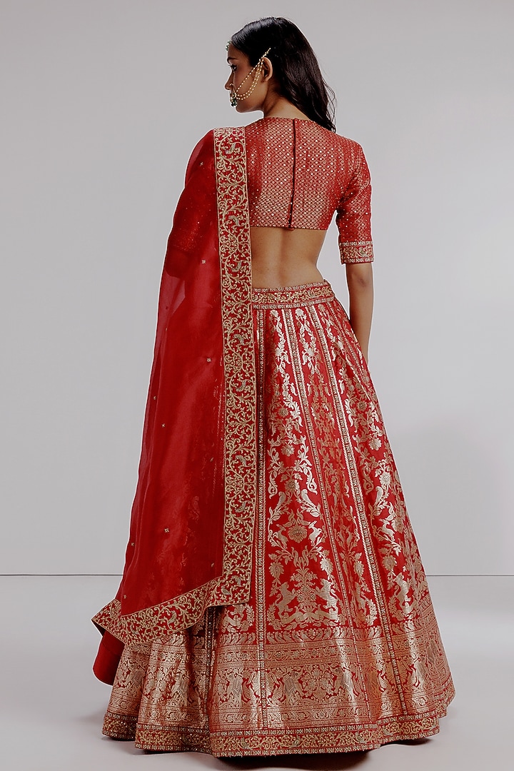 Red Banarasi Katan Silk Hand Embroidered Bridal Lehenga Set by Taisha at Pernia's Pop Up Shop