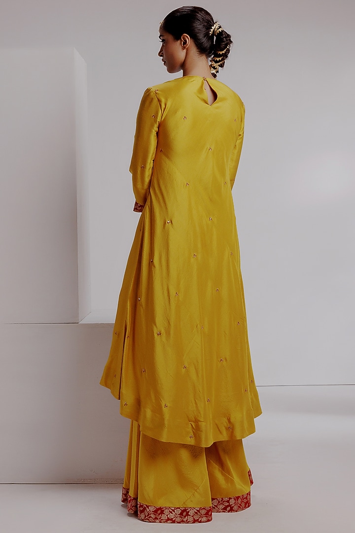 Yellow Pure Knitted Dupion Silk Hand Embroidered Kurta Set by Taisha at Pernia's Pop Up Shop