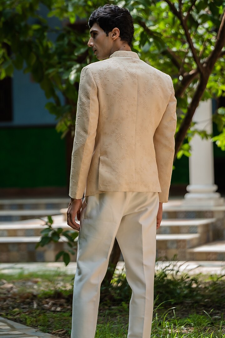 Beige Linen Machine Embroidered Bandhgala Set by TAJIRI at Pernia's Pop Up Shop