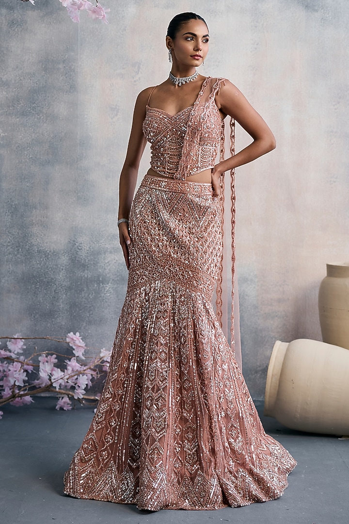 Peach Net Sequins Embroidered Fish-Cut Draped Wedding Lehenga Set by Tanaksh at Pernia's Pop Up Shop