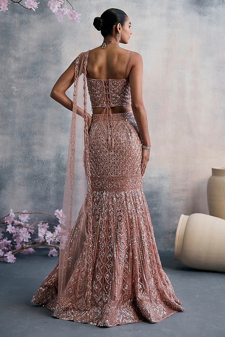 Peach Net Sequins Embroidered Fish-Cut Draped Wedding Lehenga Set by Tanaksh at Pernia's Pop Up Shop