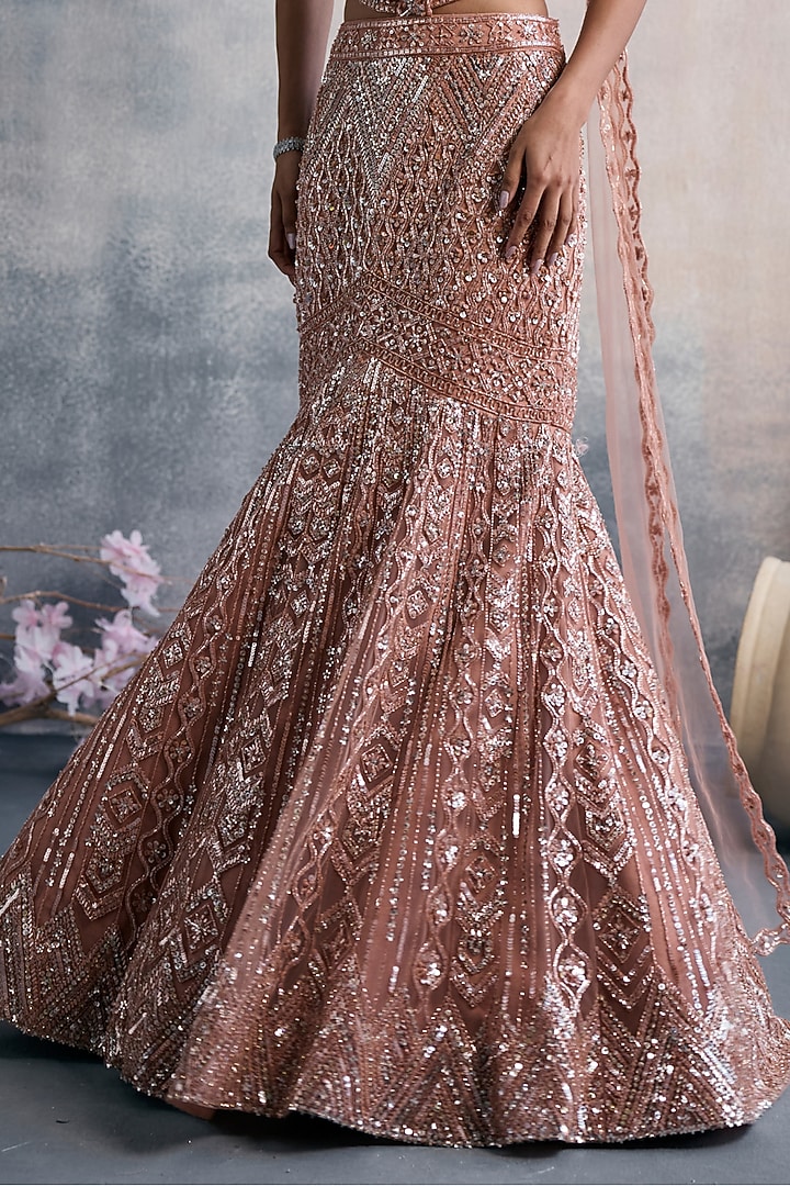 Peach Net Sequins Embroidered Fish-Cut Draped Wedding Lehenga Set by Tanaksh at Pernia's Pop Up Shop