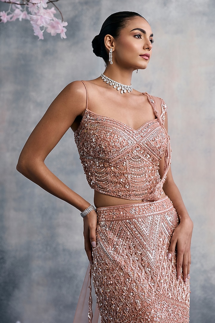 Peach Net Sequins Embroidered Fish-Cut Draped Wedding Lehenga Set by Tanaksh at Pernia's Pop Up Shop