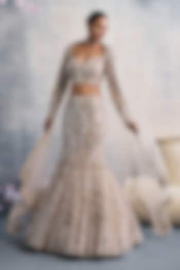 Ivory Net Sequins Embroidered Fish-Cut Wedding Lehenga Set by Tanaksh at Pernia's Pop Up Shop