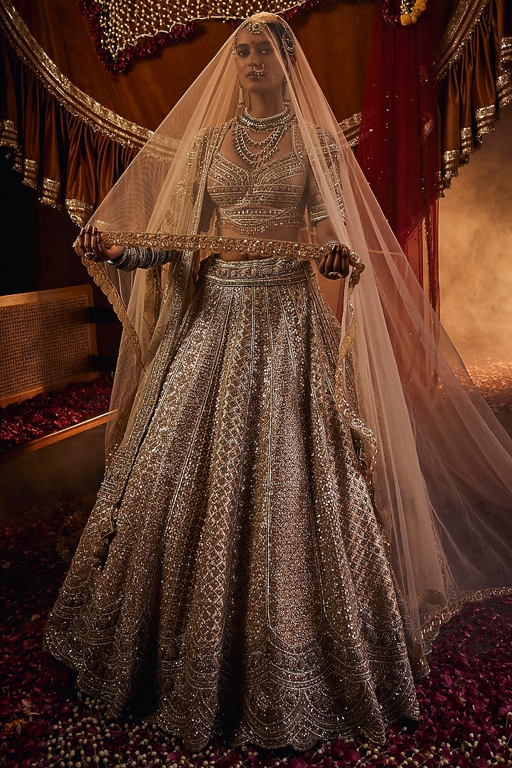 Golden Net Zari & Sequins Embroidered Bridal Lehenga Set by Tanaksh at Pernia's Pop Up Shop