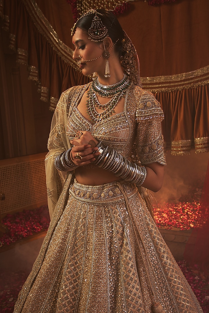 Golden Net Zari & Sequins Embroidered Bridal Lehenga Set by Tanaksh at Pernia's Pop Up Shop