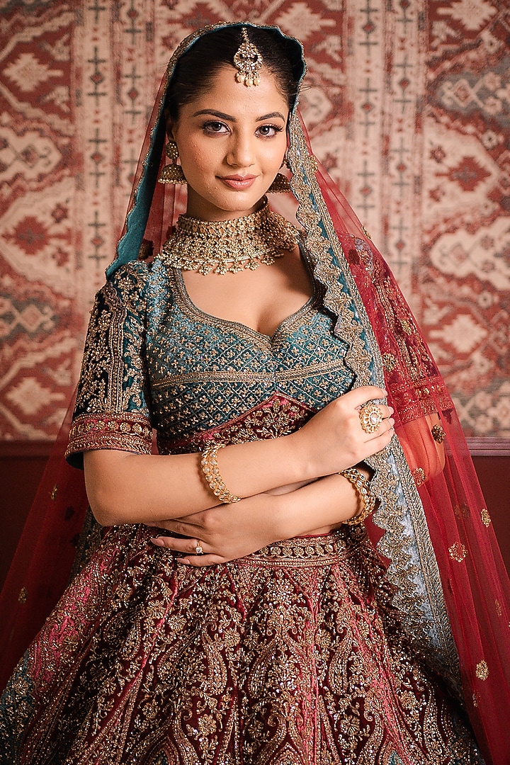 Teal & Maroon Velvet Cutdana Embroidered Bridal Lehenga Set by Tanaksh at Pernia's Pop Up Shop