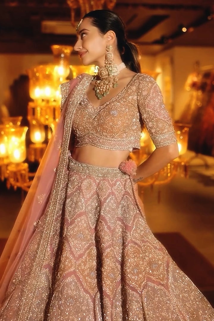 Soft Pink Net Sequins & Cutdana Embroidered Bridal Lehenga Set by Tanaksh at Pernia's Pop Up Shop