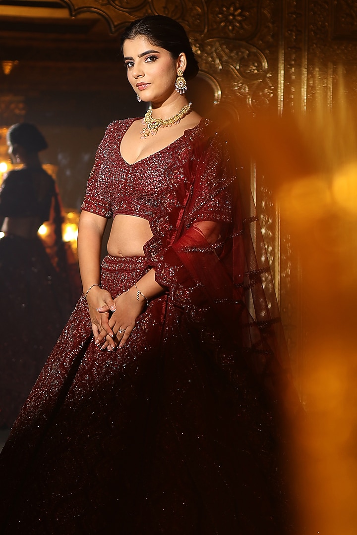 Maroon Velvet Dori & Crystal Embroidered Bridal Lehenga Set by Tanaksh at Pernia's Pop Up Shop