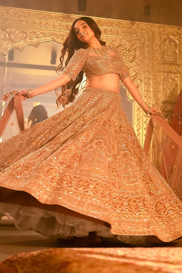 Rose Gold Net Nakshi & Dori Embroidered Bridal Lehenga Set by Tanaksh at Pernia's Pop Up Shop