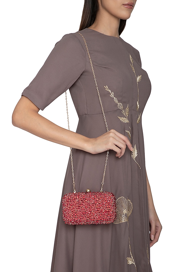 Red Stones Embellished Clutch by Tarini Nirula at Pernia's Pop Up Shop