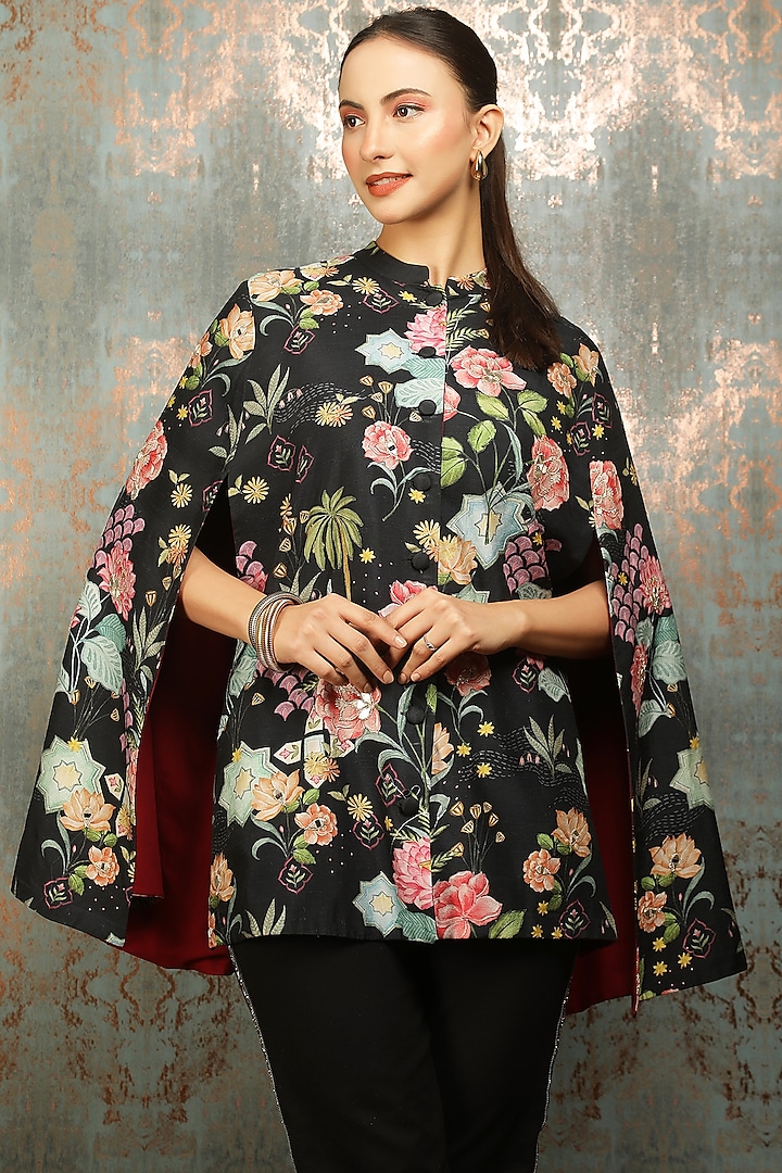 Black Raw Silk Printed & Mirror Work Cape by Tanu Malhotra at Pernia's Pop Up Shop