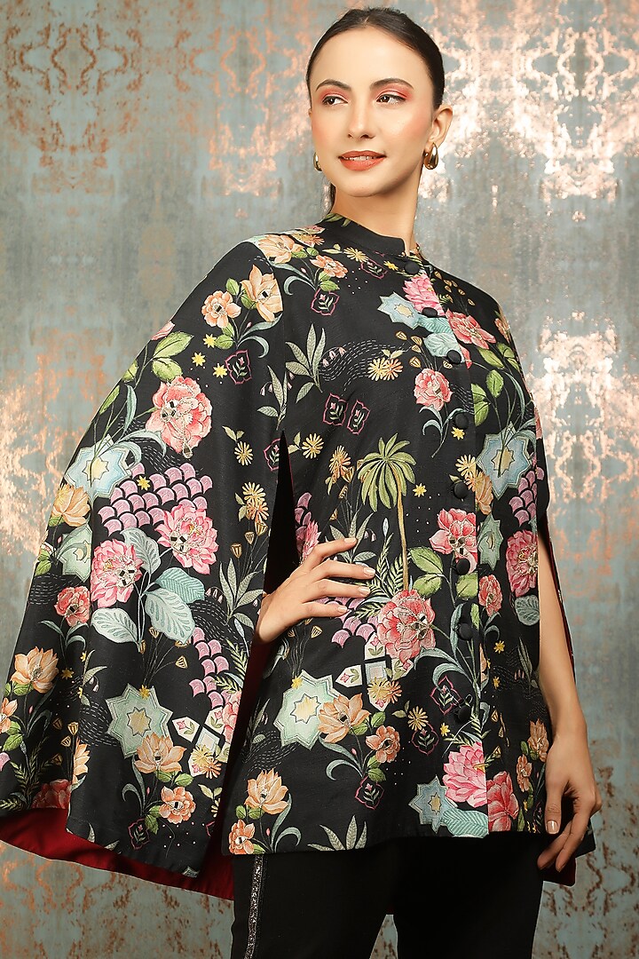 Black Raw Silk Printed & Mirror Work Cape by Tanu Malhotra at Pernia's Pop Up Shop