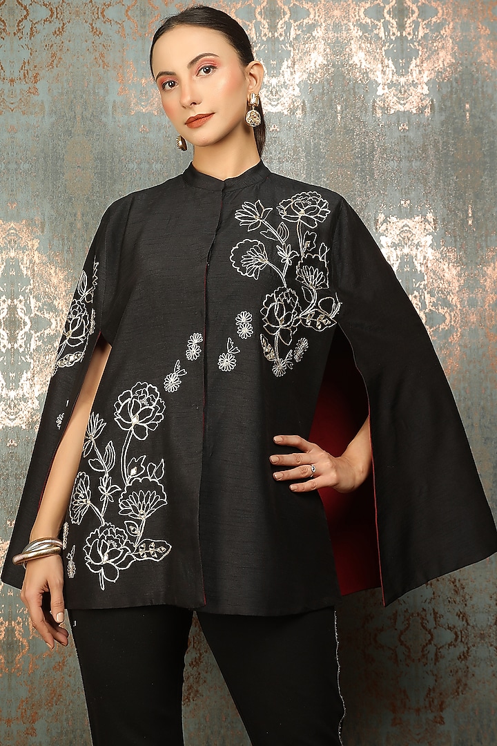 Black Raw Silk Floral Embroidered Cape by Tanu Malhotra at Pernia's Pop Up Shop