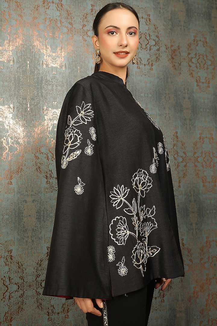 Black Raw Silk Floral Embroidered Cape by Tanu Malhotra at Pernia's Pop Up Shop