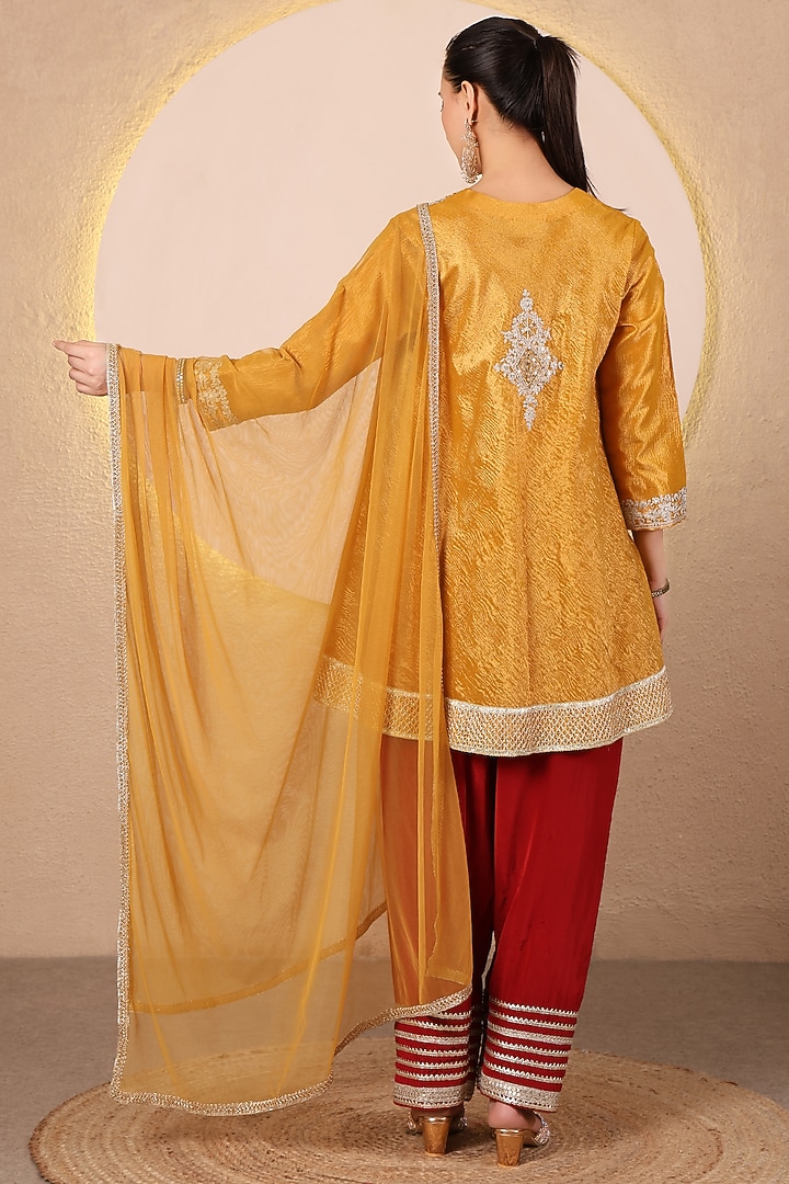 Mustard Yellow Crushed Tissue Embroidered Flared kurta Set by Tanu Malhotra at Pernia's Pop Up Shop