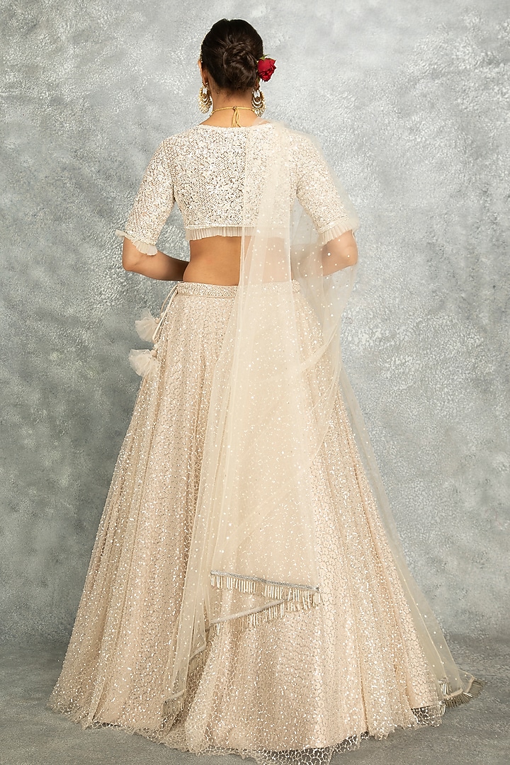 Ivory Net Embroidered Flowy Wedding Lehenga Set by Tanu Malhotra at Pernia's Pop Up Shop