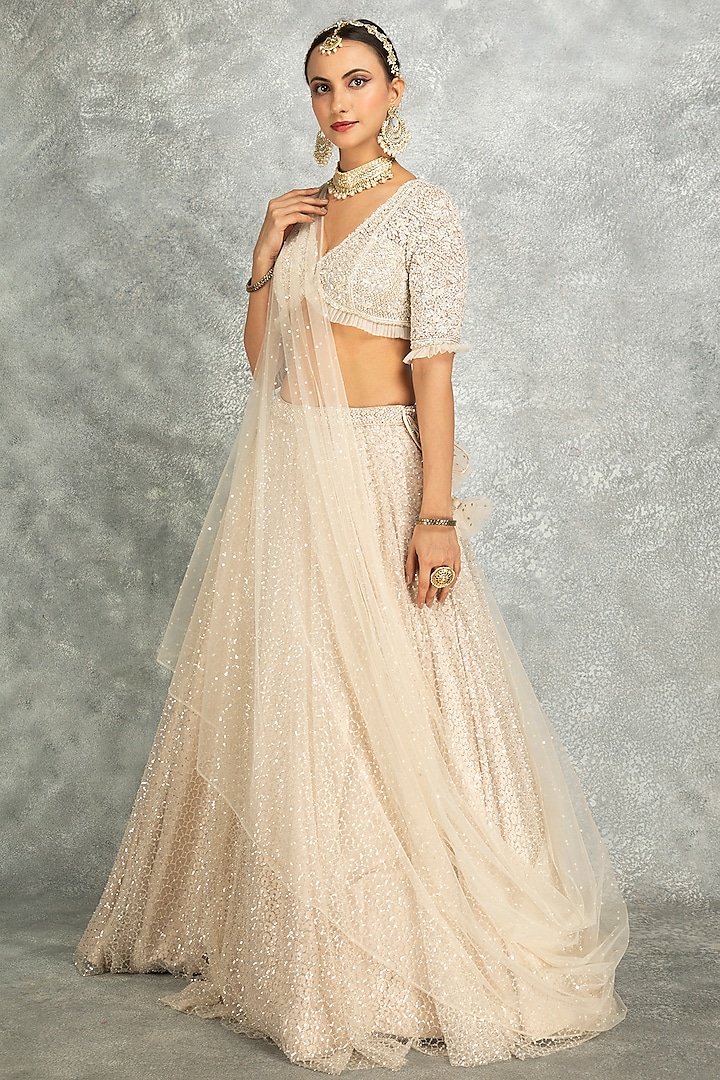 Ivory Net Embroidered Flowy Wedding Lehenga Set by Tanu Malhotra at Pernia's Pop Up Shop