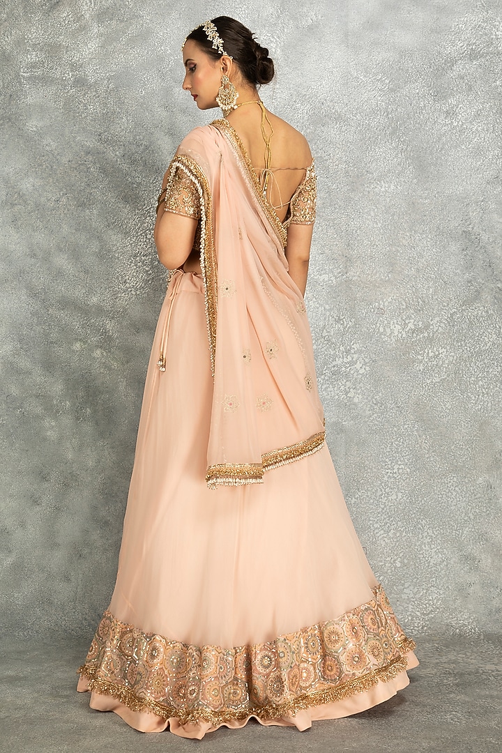 Peach Georgette Sequins Embroidered Wedding Lehenga Set by Tanu Malhotra at Pernia's Pop Up Shop