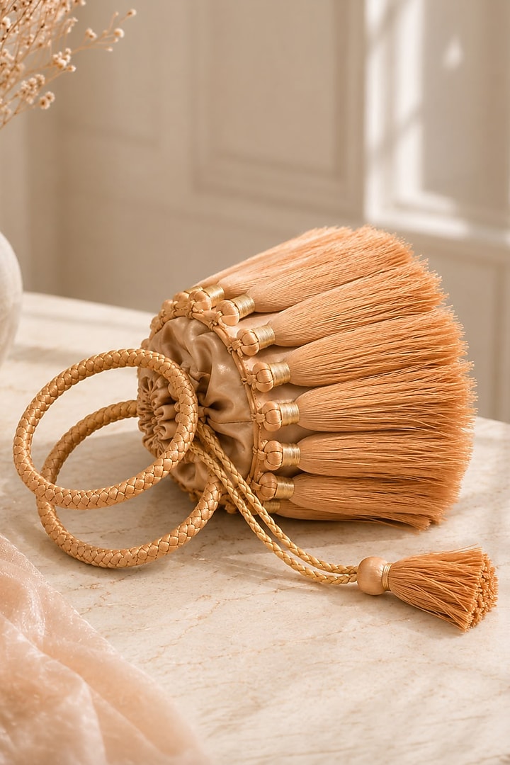 Gold Satin Fringe Embellished Potli by TAN Studio at Pernia's Pop Up Shop