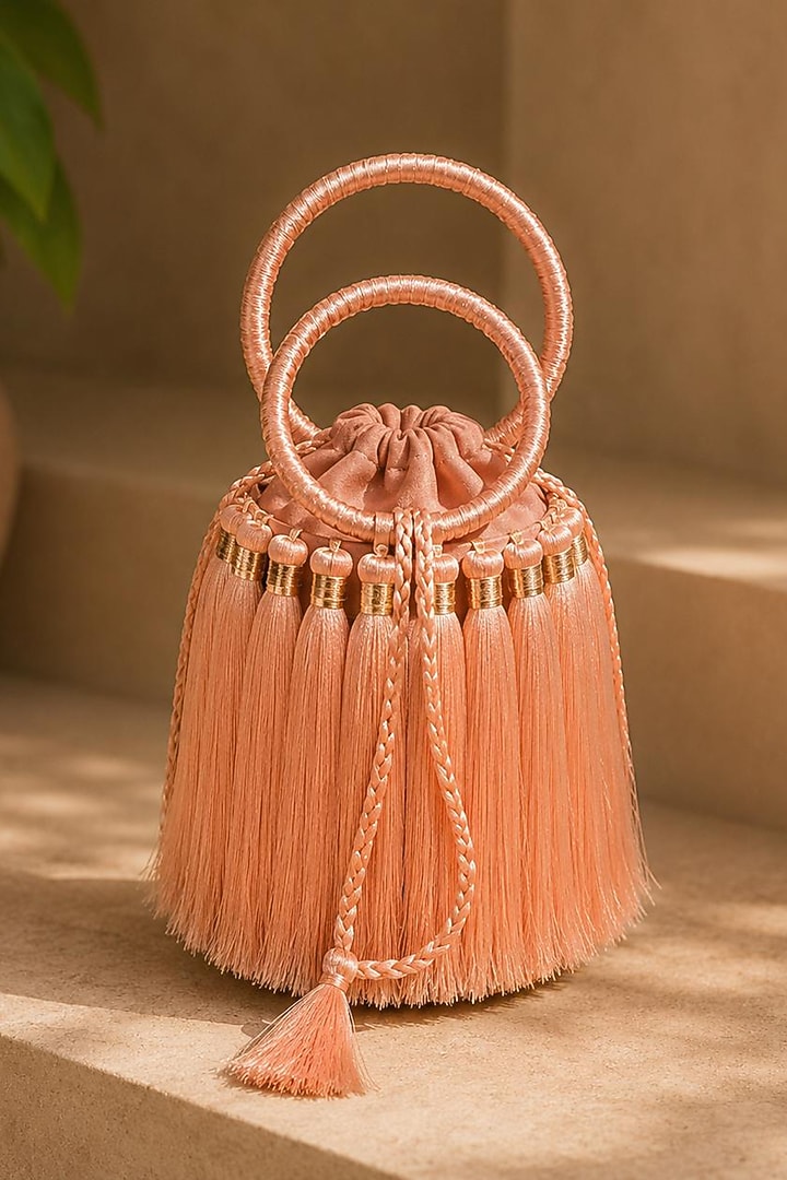 Peach Satin Embellished Textured Potli by TAN Studio at Pernia's Pop Up Shop