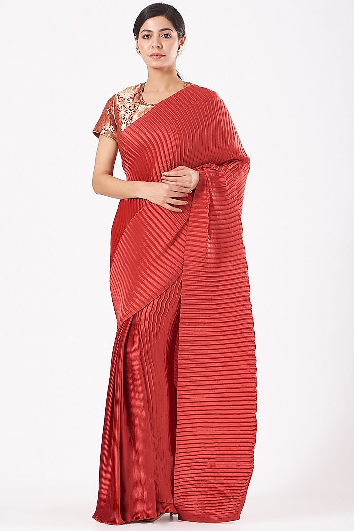 Cadmium Red Pleated Polyester Skirt Saree Set by Tasuvure Indes