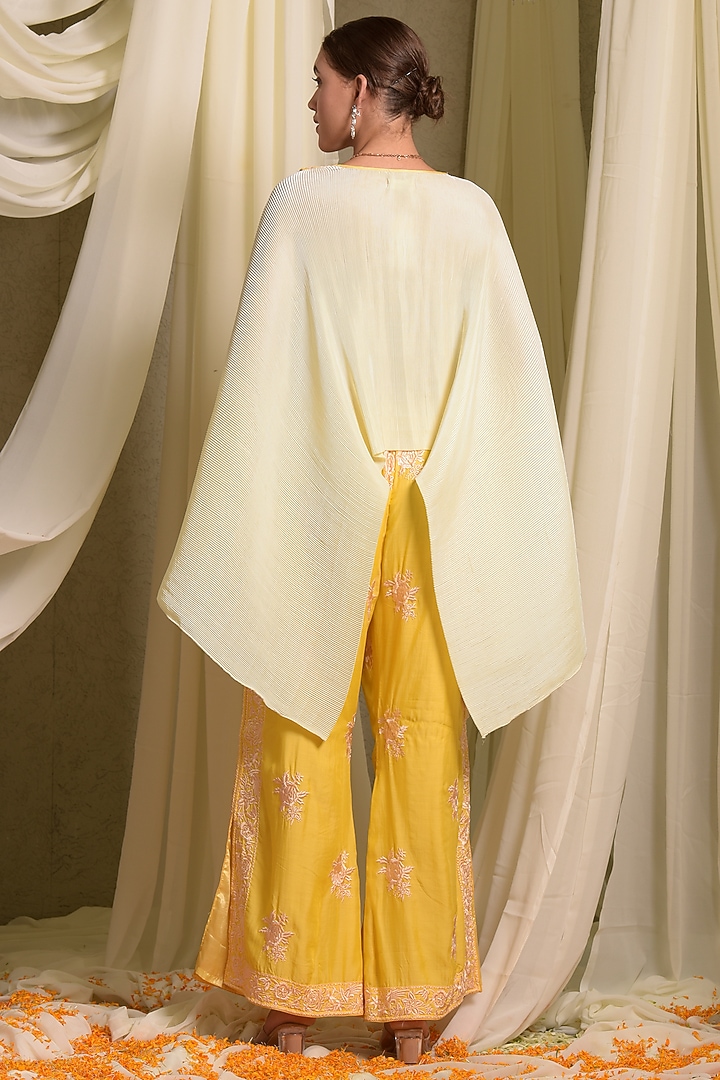 Yellow Pleated Silk & Georgette Embroidered Cape Set by Tasuvure at Pernia's Pop Up Shop