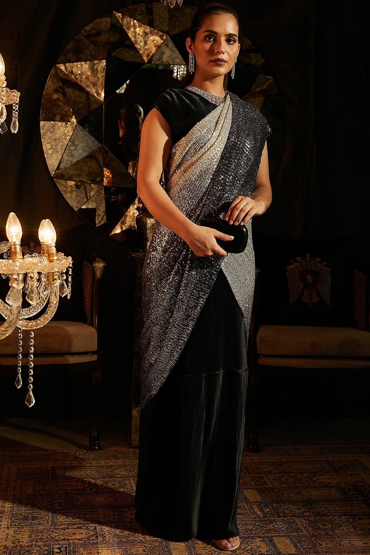 Photo of Black saree with net blouse and silver motifs