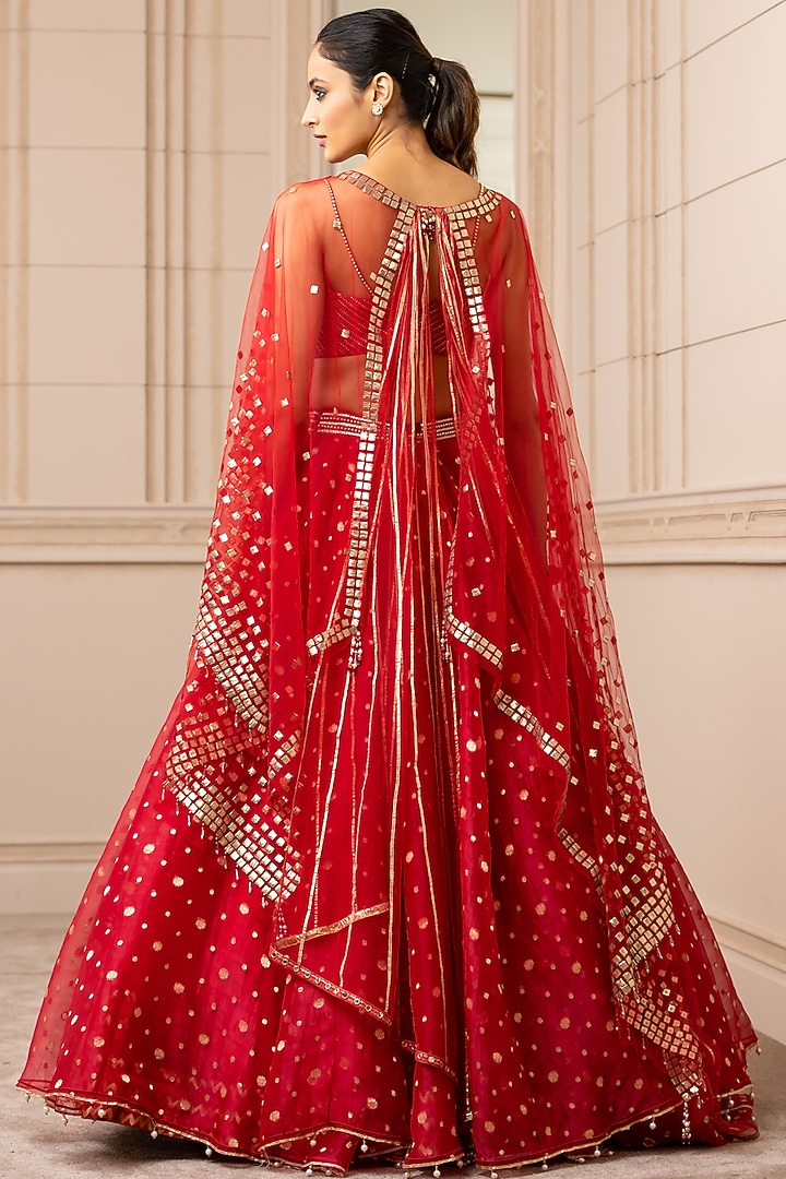Fiery Red Embroidered Asymmetrical Bridal Lehenga Set With Cape by Tarun Tahiliani at Pernia's Pop Up Shop