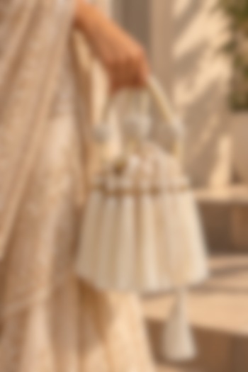 Ivory Satin Fringe Embellished Potli by TAN Studio at Pernia's Pop Up Shop