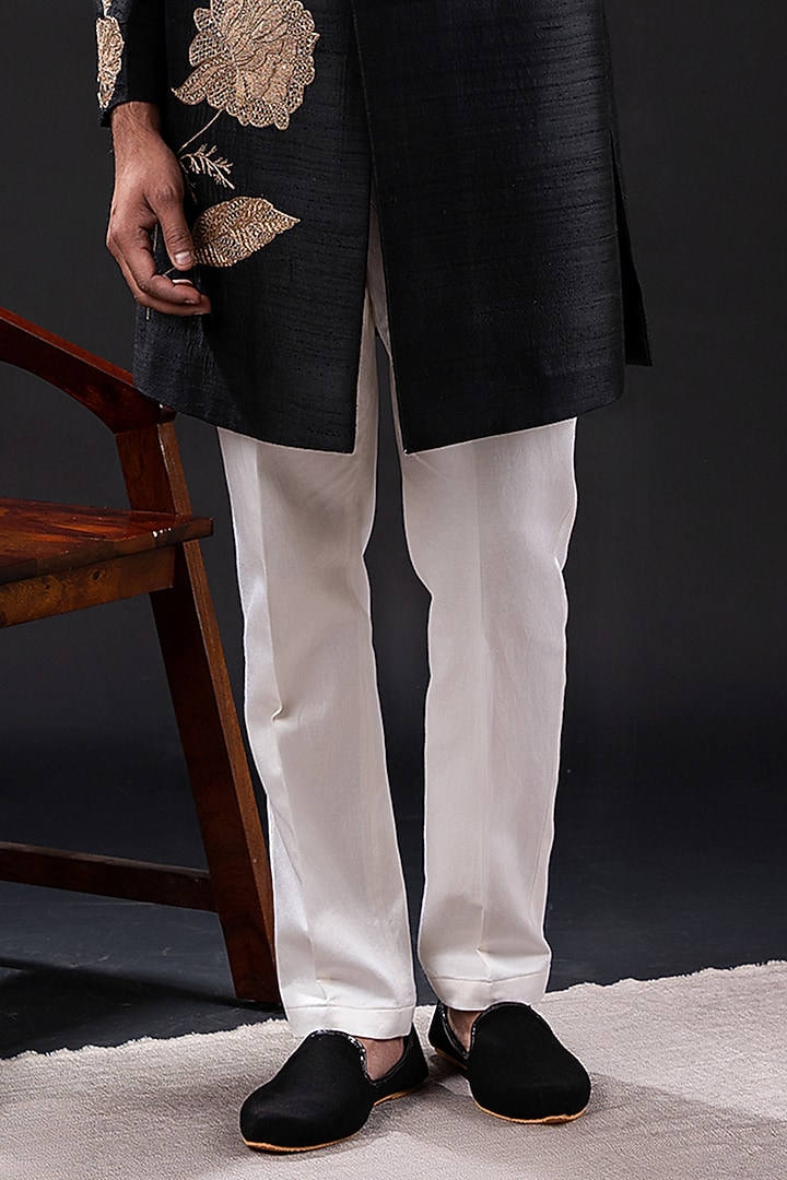 Black Raw Silk & Cotton Embellished Groom Sherwani Set by TIRA BY NARESH RAJ at Pernia's Pop Up Shop