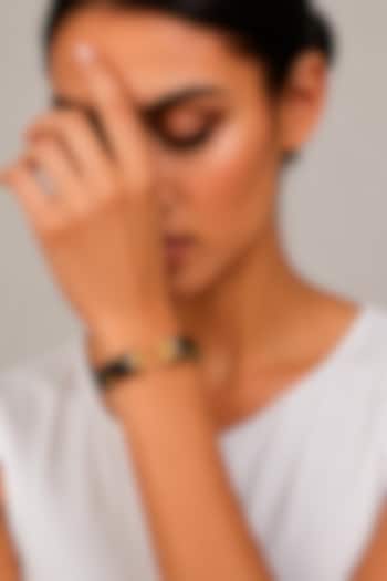 Gold Finish Topaz Stone Enameled Bangle by Tad Accessories at Pernia's Pop Up Shop